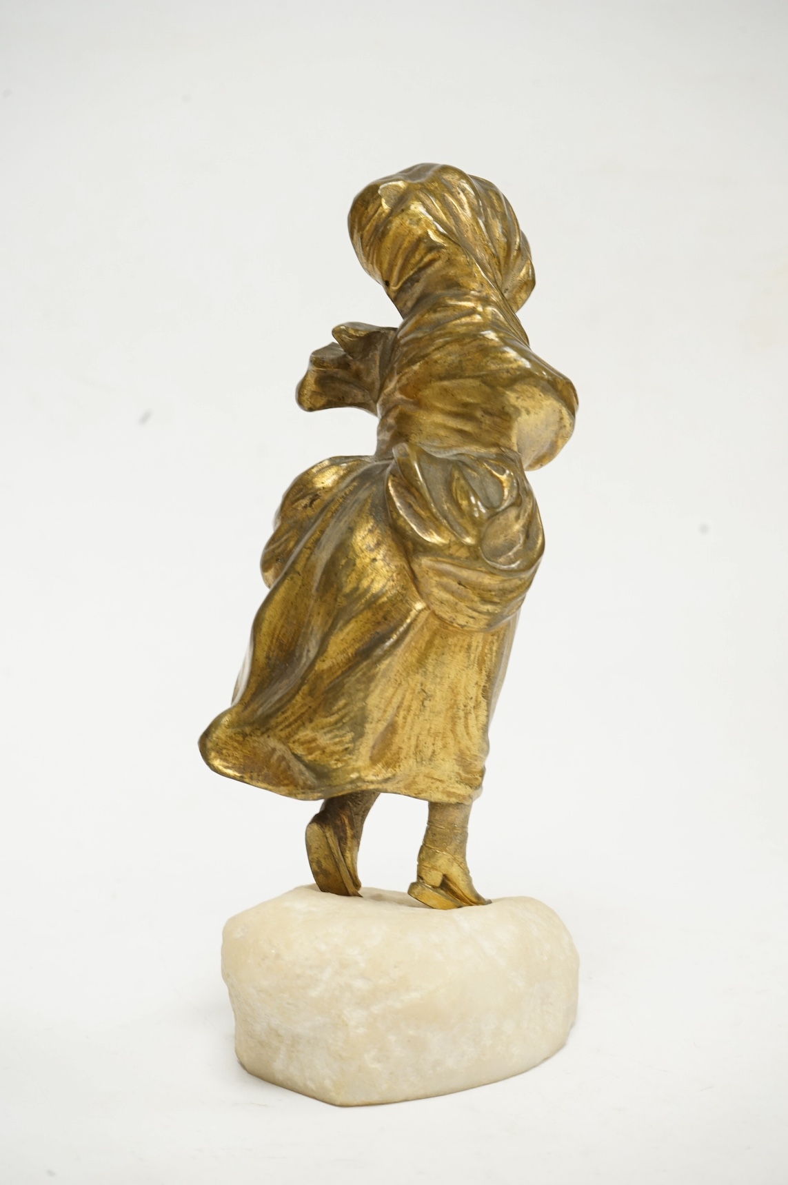 After Affortunato Gory, a bronze and ivory figure of a windswept skating girl, incised script signature to granite base, 19cm high. CITES Submission reference LWATX8X8